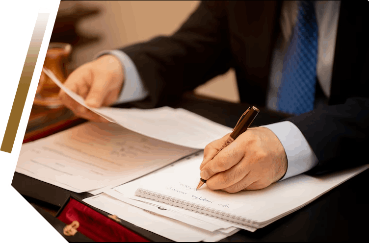 Writing on documents at desk